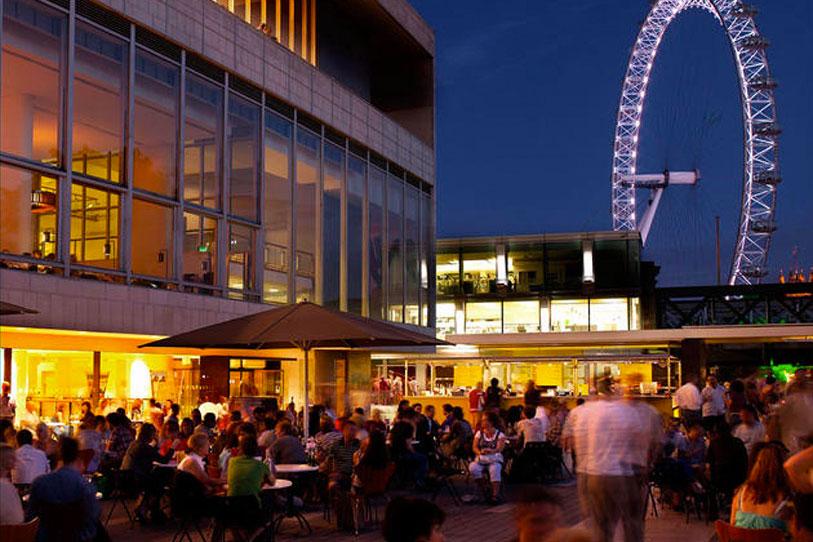 Southbank Centre shown at night with the London Eye in the background