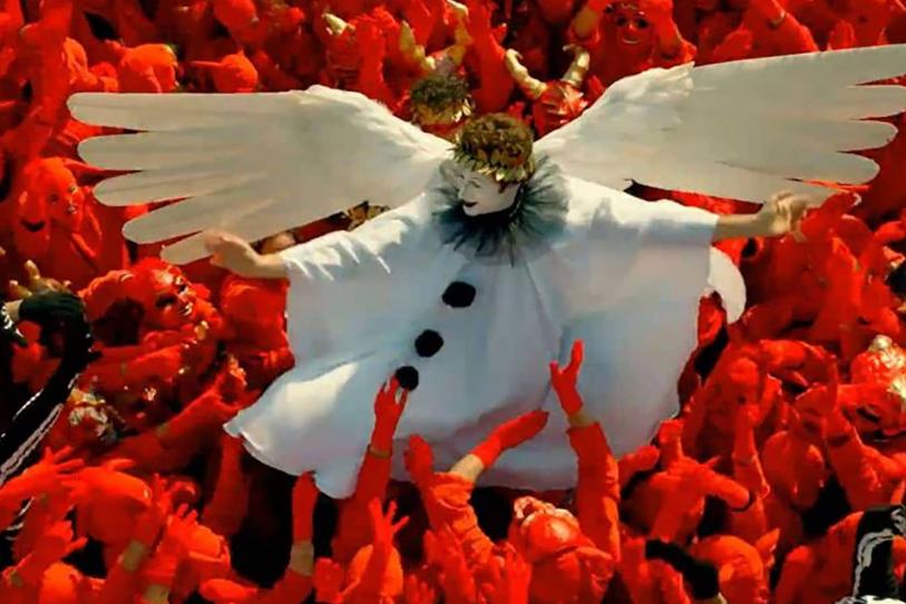 Performers dressed as angels and devils during a poetry reading