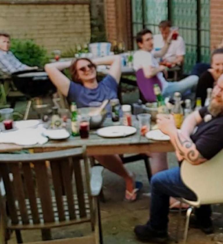 Image showing Axis12 staff socialising around a BBQ